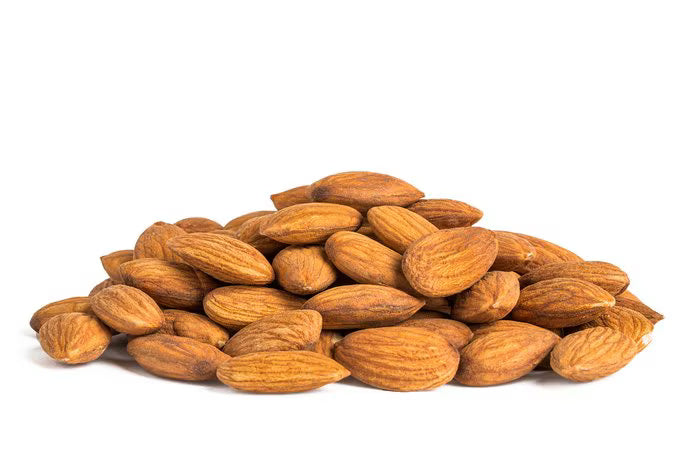 Pile of almonds on a white background