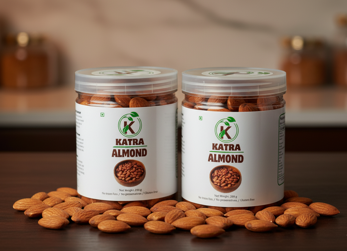 Two jars of Katra Almond on a wooden surface with almonds scattered around.