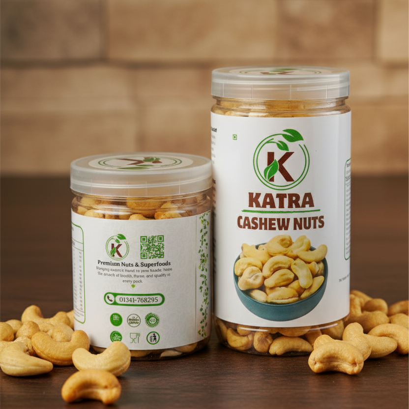 Two jars of Katra Cashew Nuts on a wooden surface with a brown brick wall background.