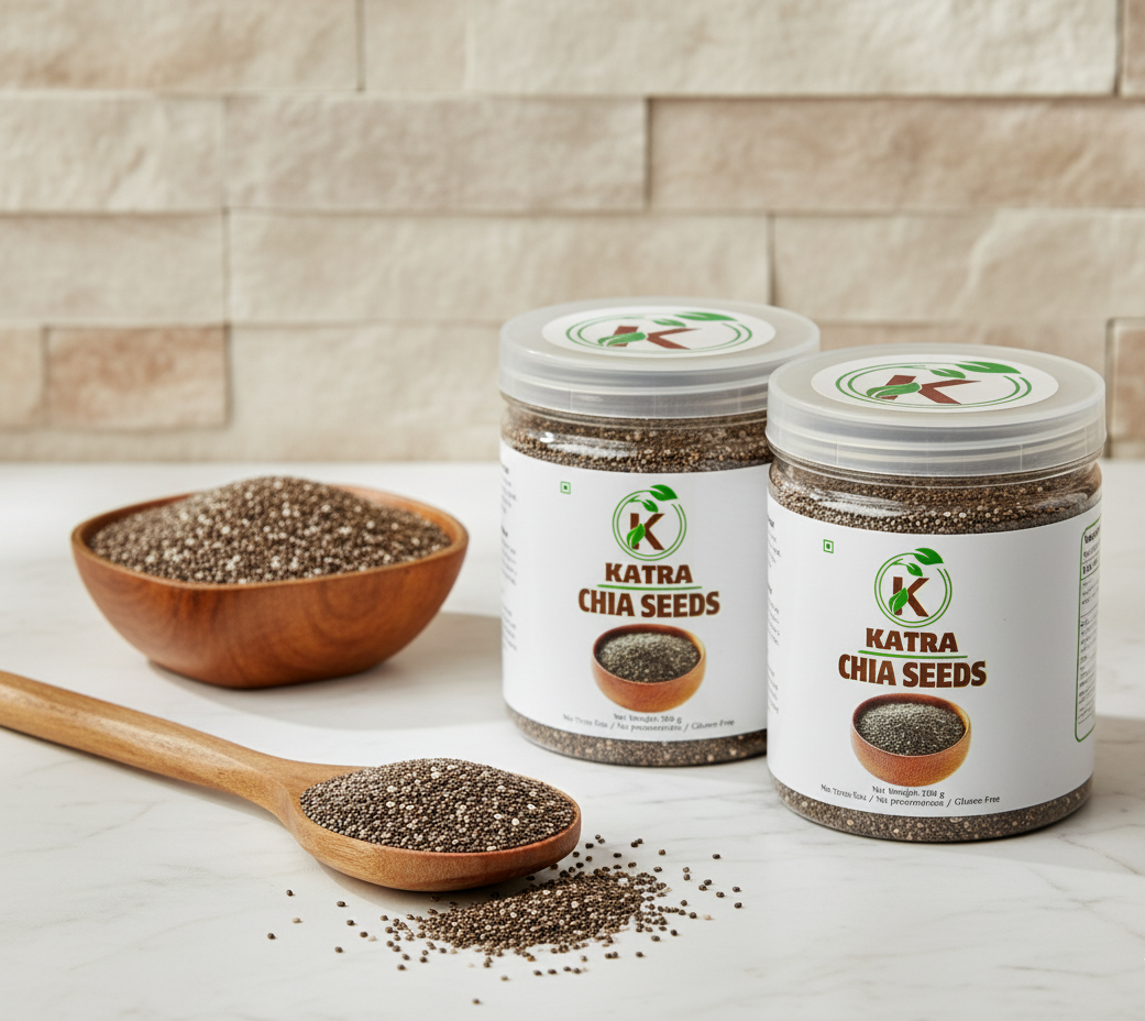 Two jars of Katra Chia Seeds on a countertop with a wooden spoon and bowl of seeds.